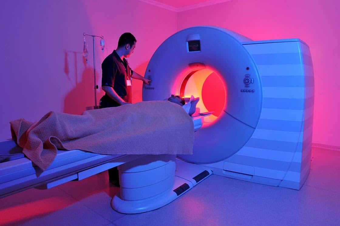 A patient is going through an MRI machine health carrier