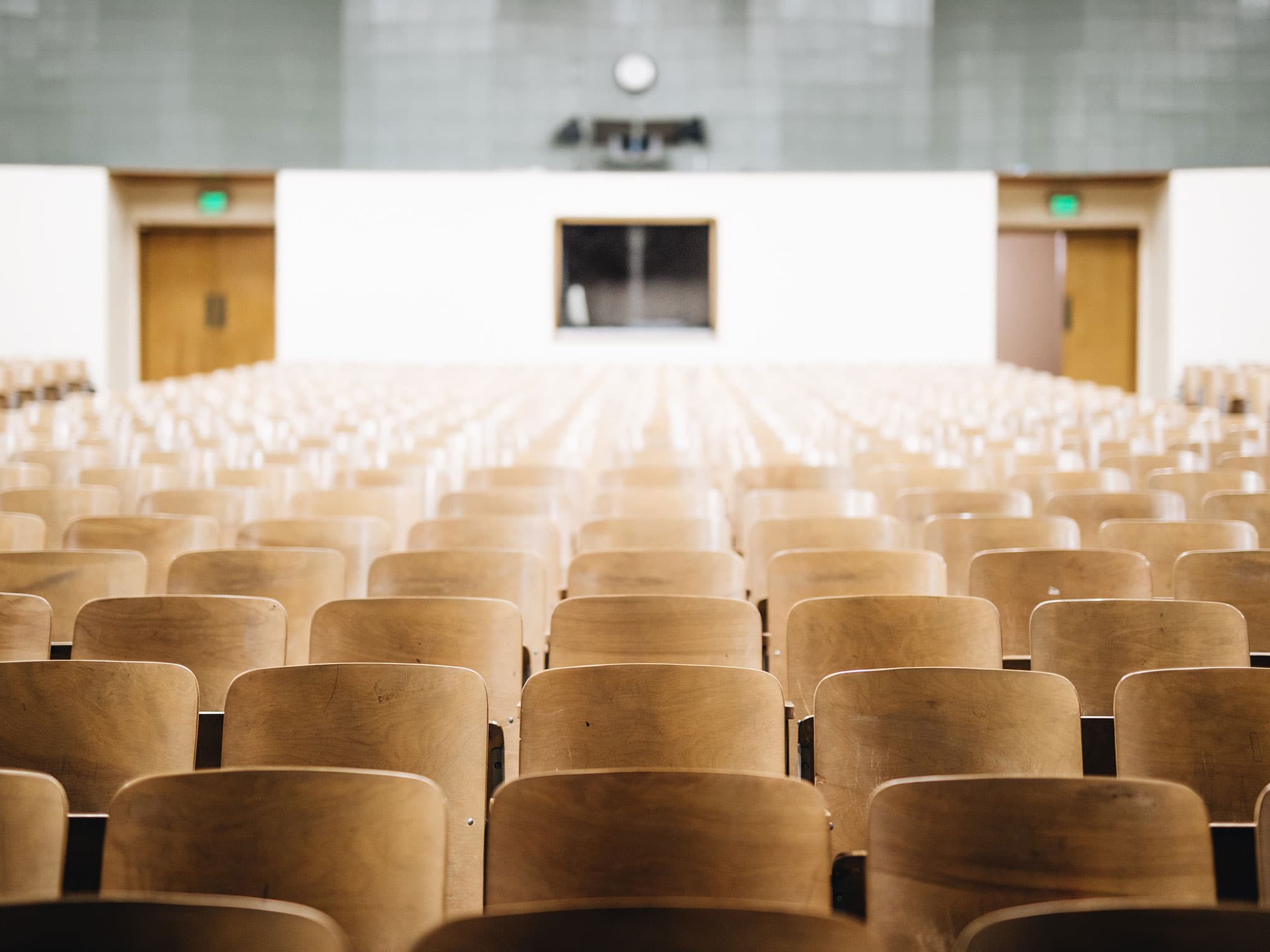 A auditorium with empty seats procurement