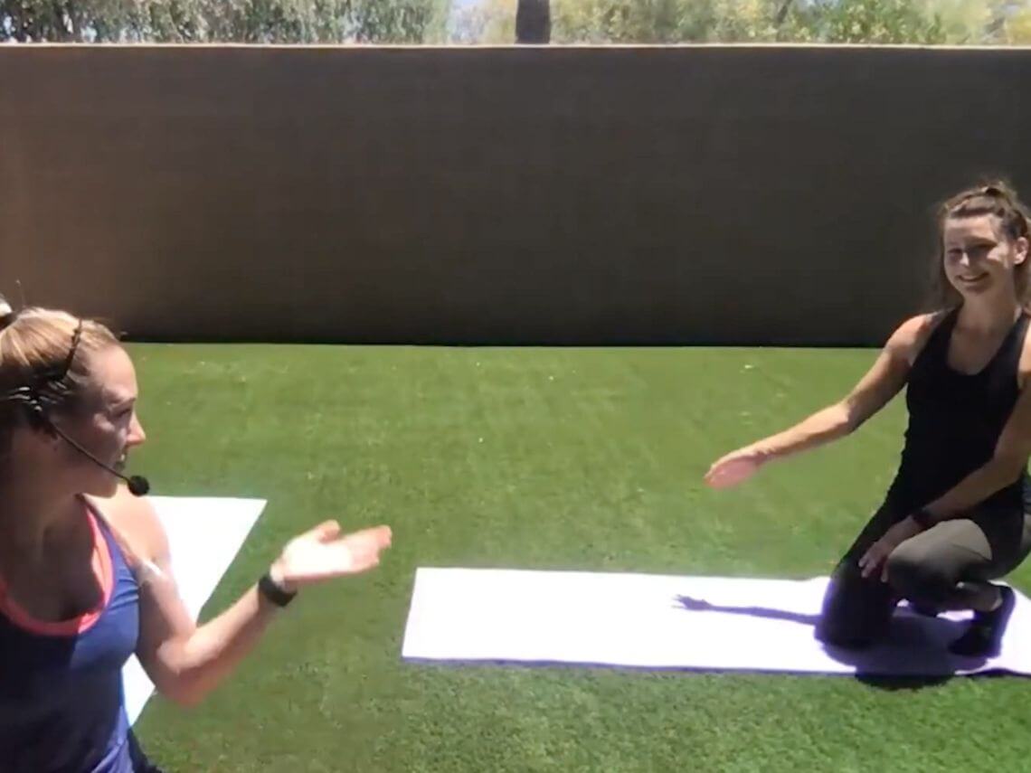 two girls doing yoga in their backyard