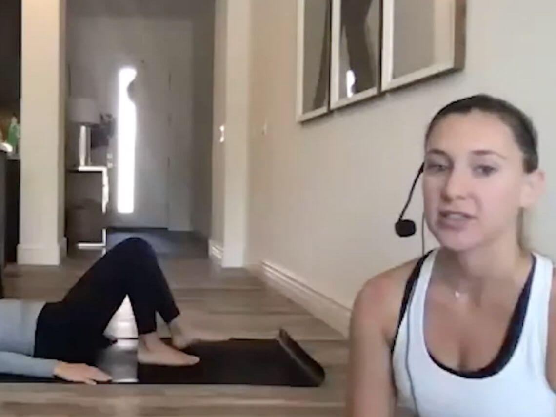 Two wellstyles instructors are doing yoga inside their home