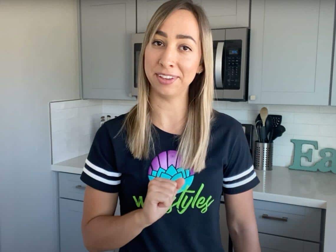 A woman is in her kitchen going over healthy, better bites tips