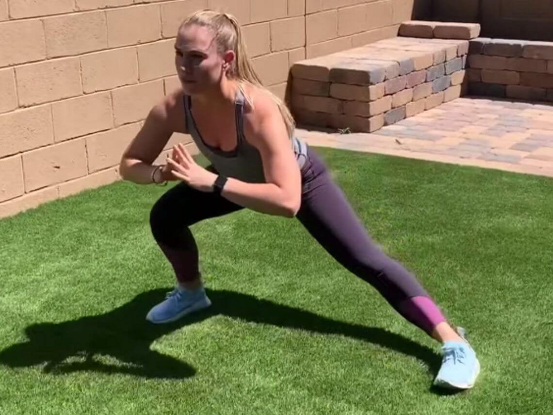 A female is doing a recovery workout in her backyard