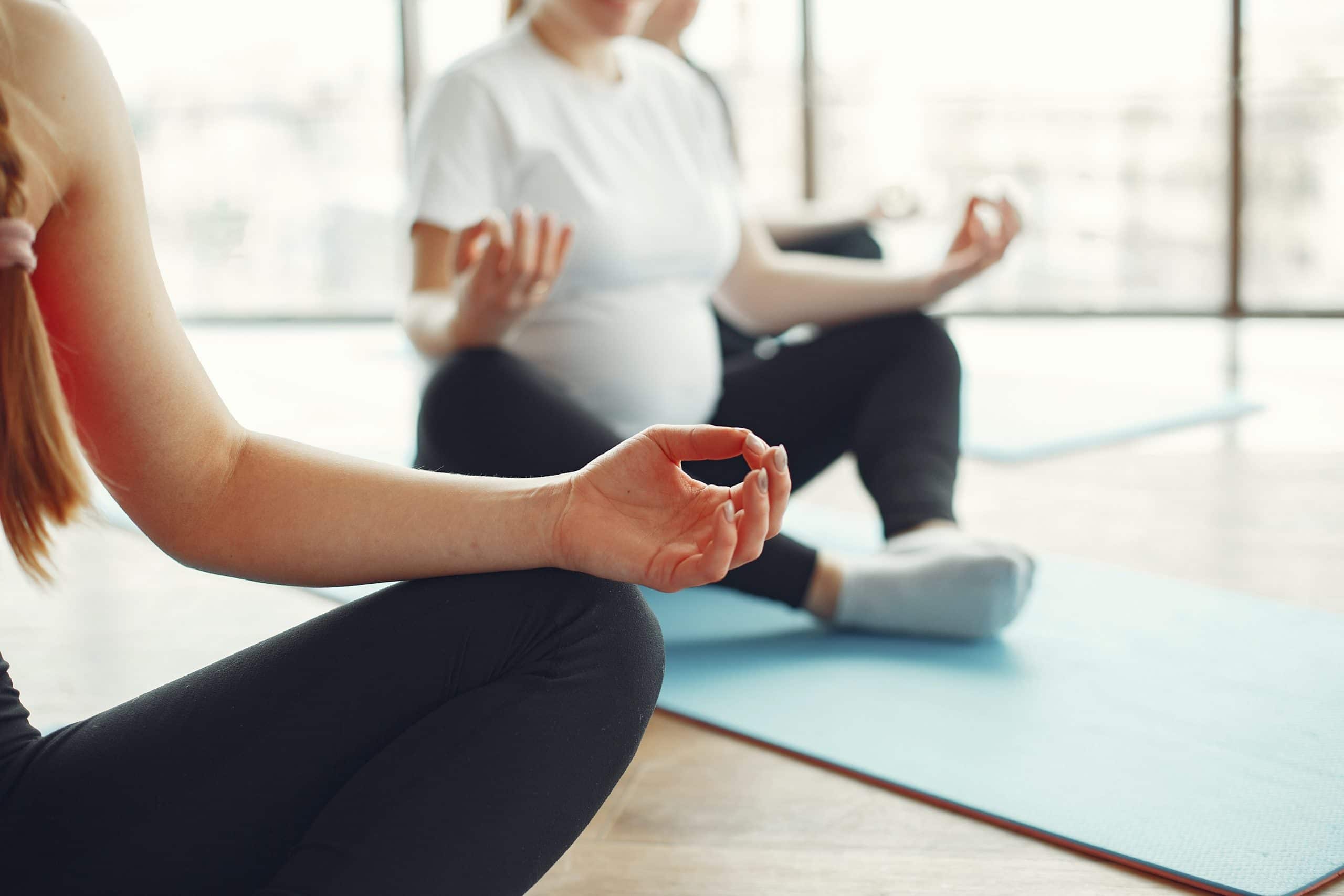 Women meditating, Healthiest Employers
