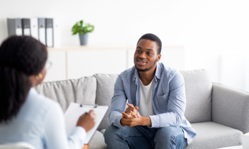 Man talking to benefits consultant.